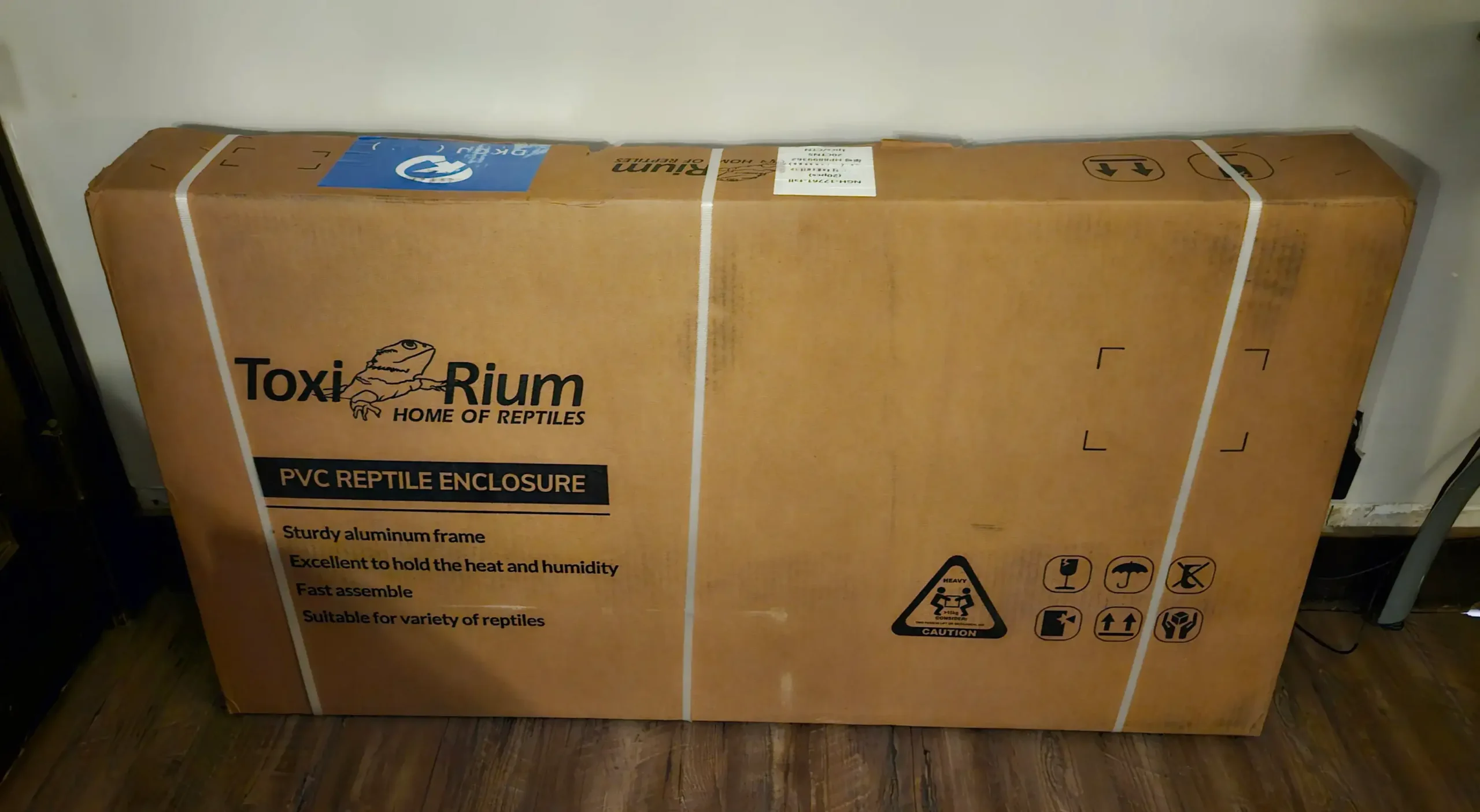 Toxirium PVC Reptile Enclosure shipping box with caution label